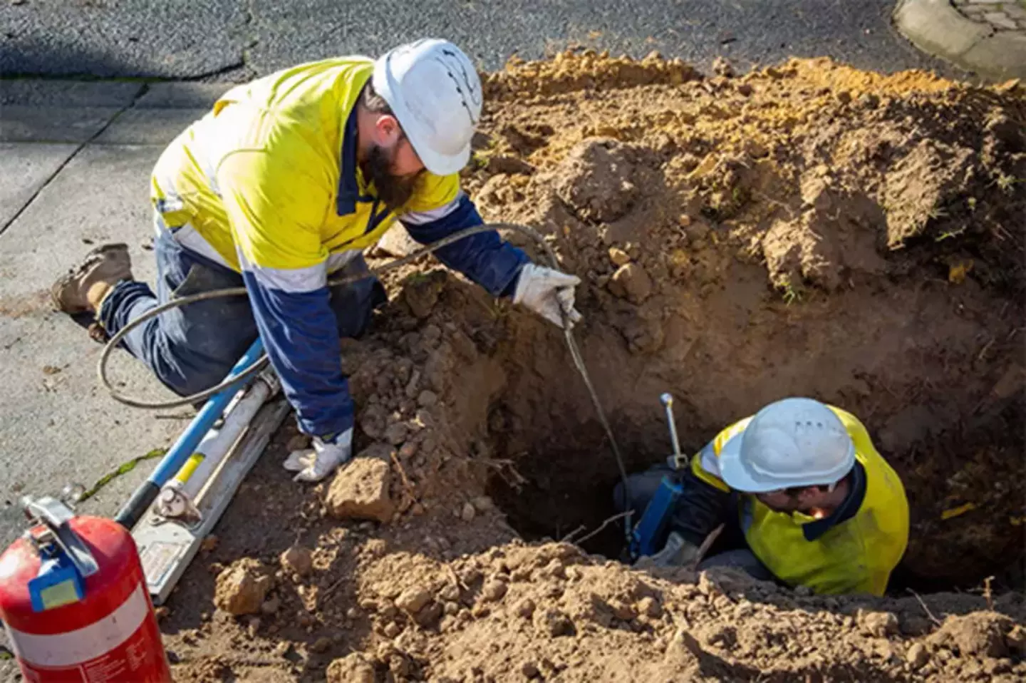 2 gas pipe lines workers, and one is working the underground