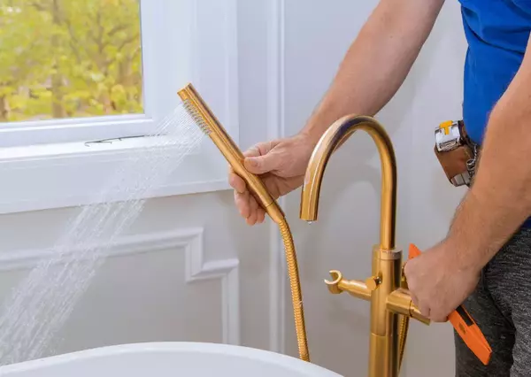 Plumber testing the hot water 