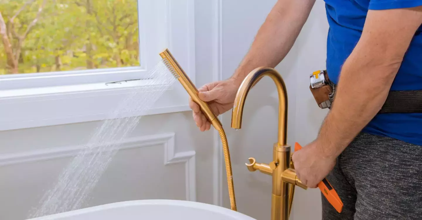 Plumber testing the hot water 