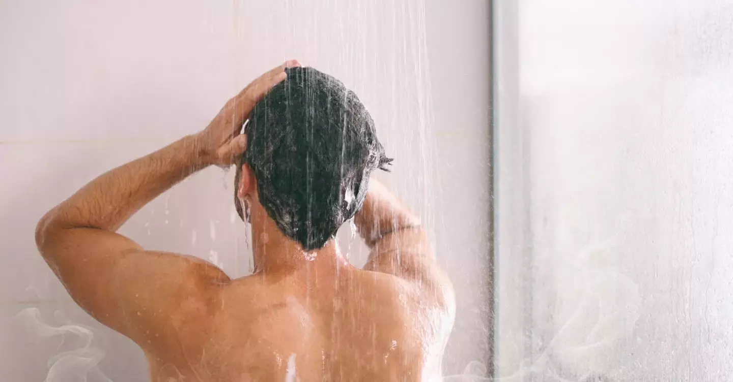A man taking a warm shower with reliable gas hot water