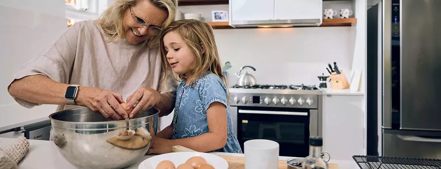 mother and daughter cooking