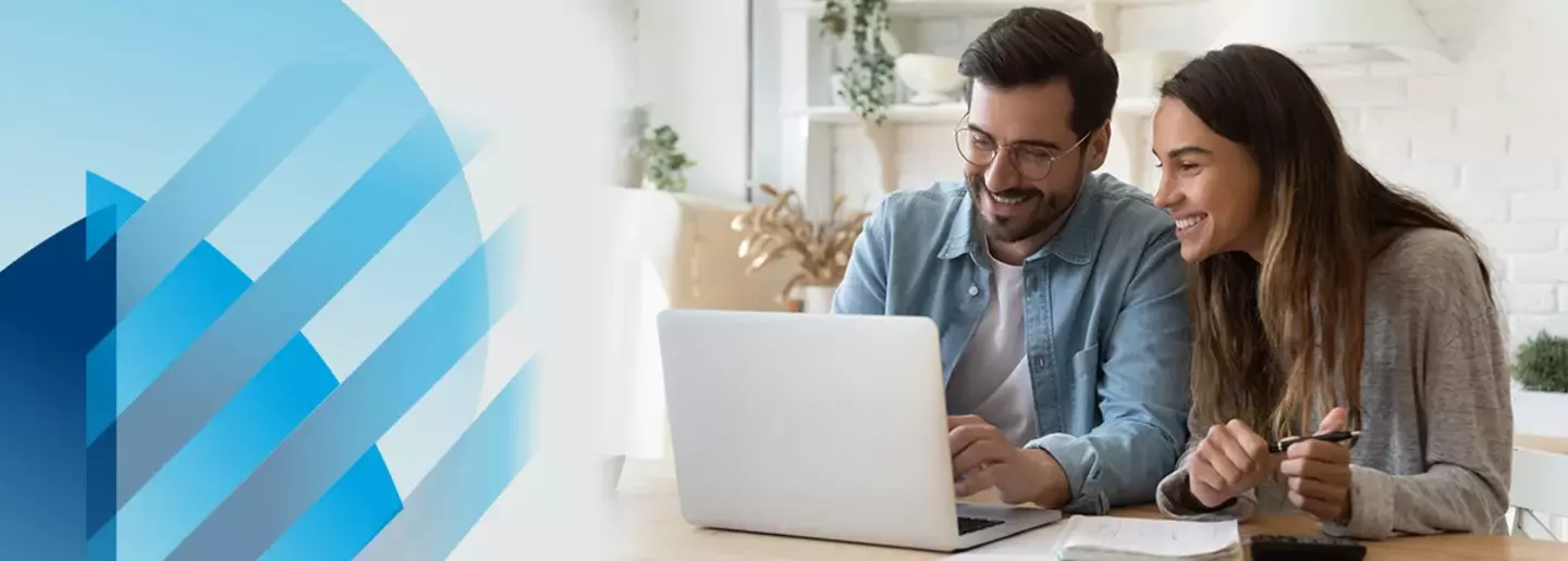 A couple working together with a laptop.